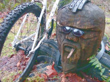 Groovy Octopus Man is carved from a stump.